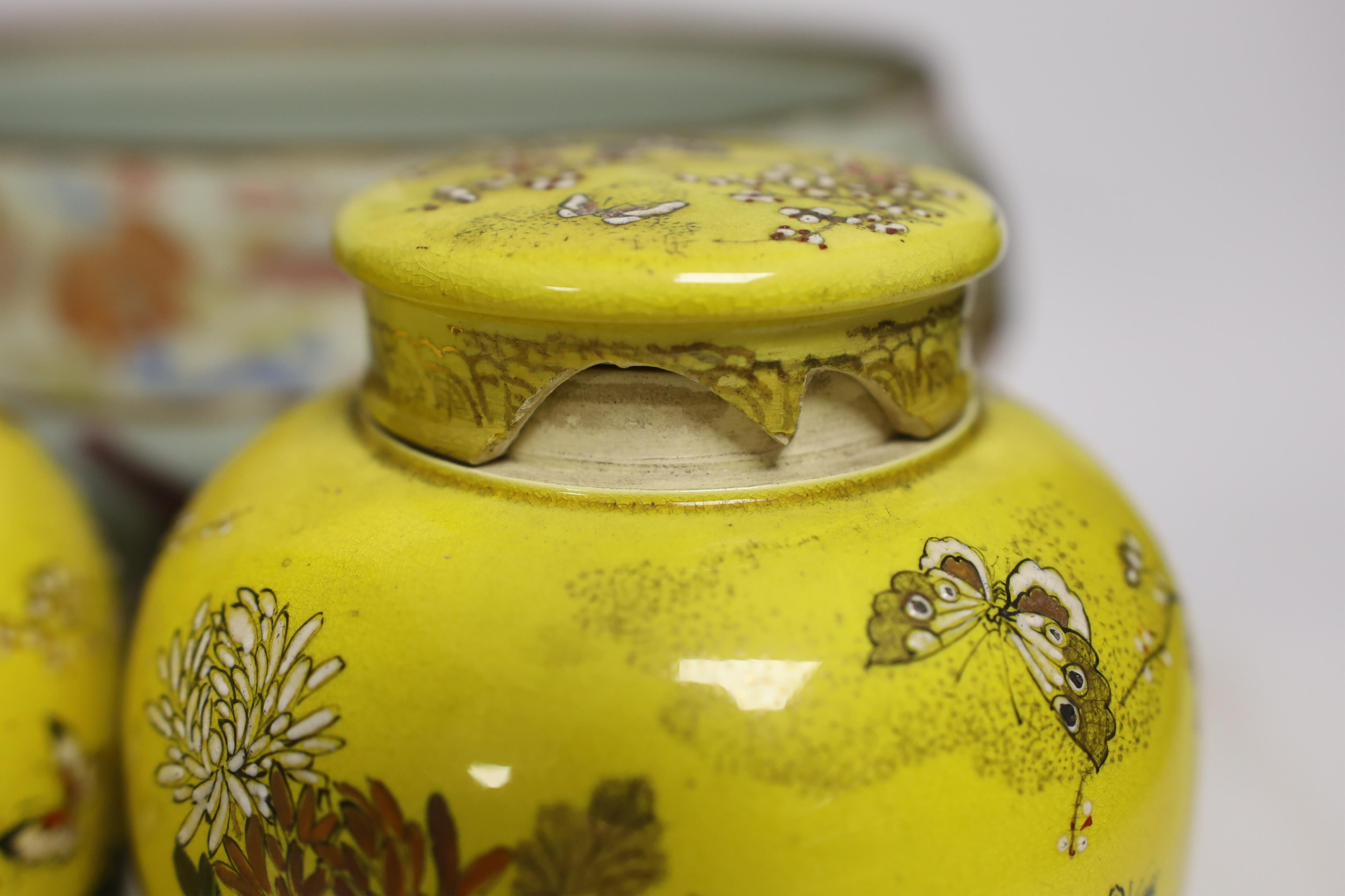 A 19th century Chinese famille rose tureen (lacking cover), a bronze mirror, a brush pot, a crackle glazed teabowl and a pair of Japanese yellow glazed satsuma jars and covers, tallest 18cm (6)